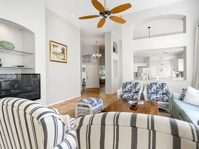 a bedroom with bed and a chandelier