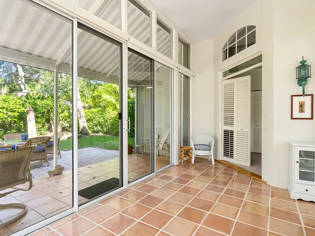 a view of an entryway with floor to ceiling window