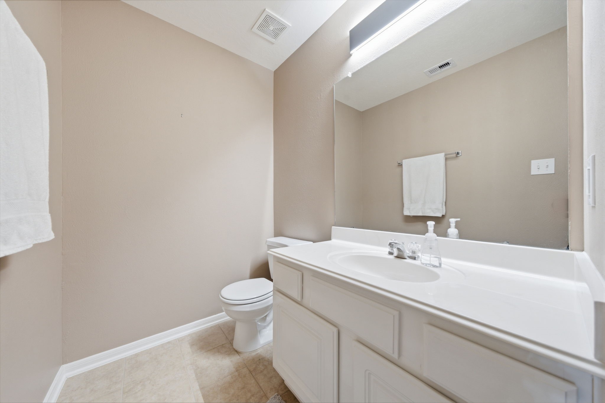8911 Henrico Lane Rosenberg, TX 77469 - Photo 26 of 45 a bathroom with a sink a toilet and a mirror