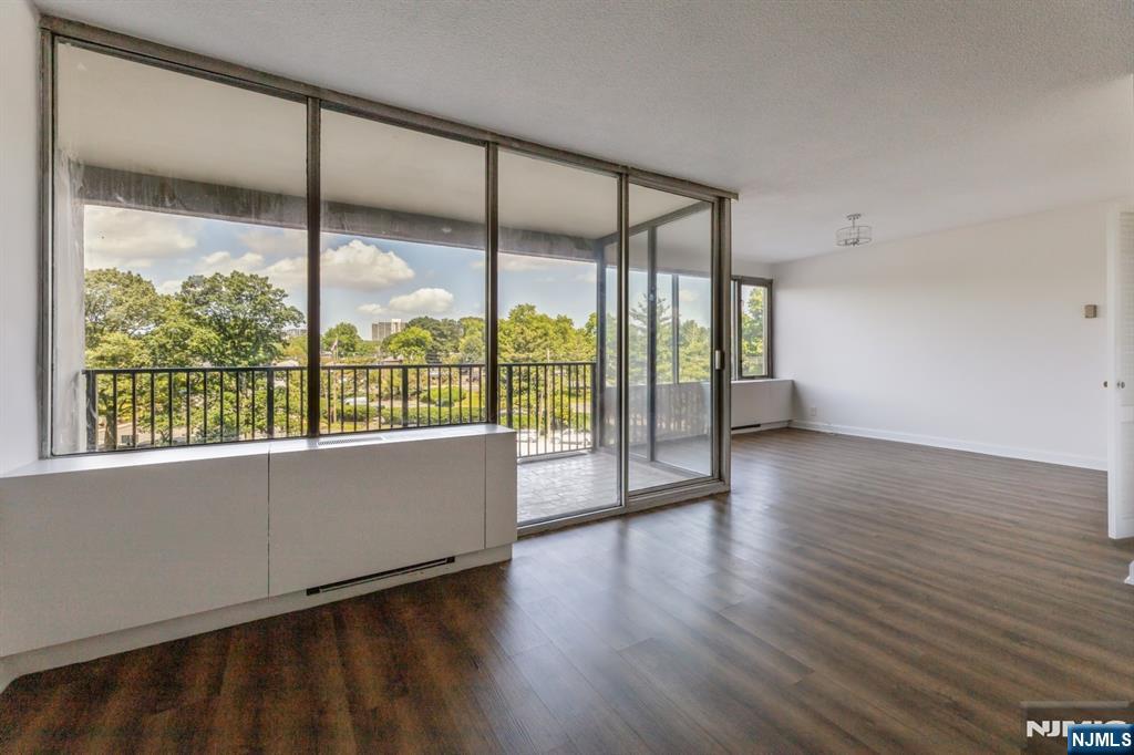 6 Horizon Road, Unit 310 Fort Lee, NJ 07024 - Photo 13 of 35 a view of an empty room with wooden floor and a window