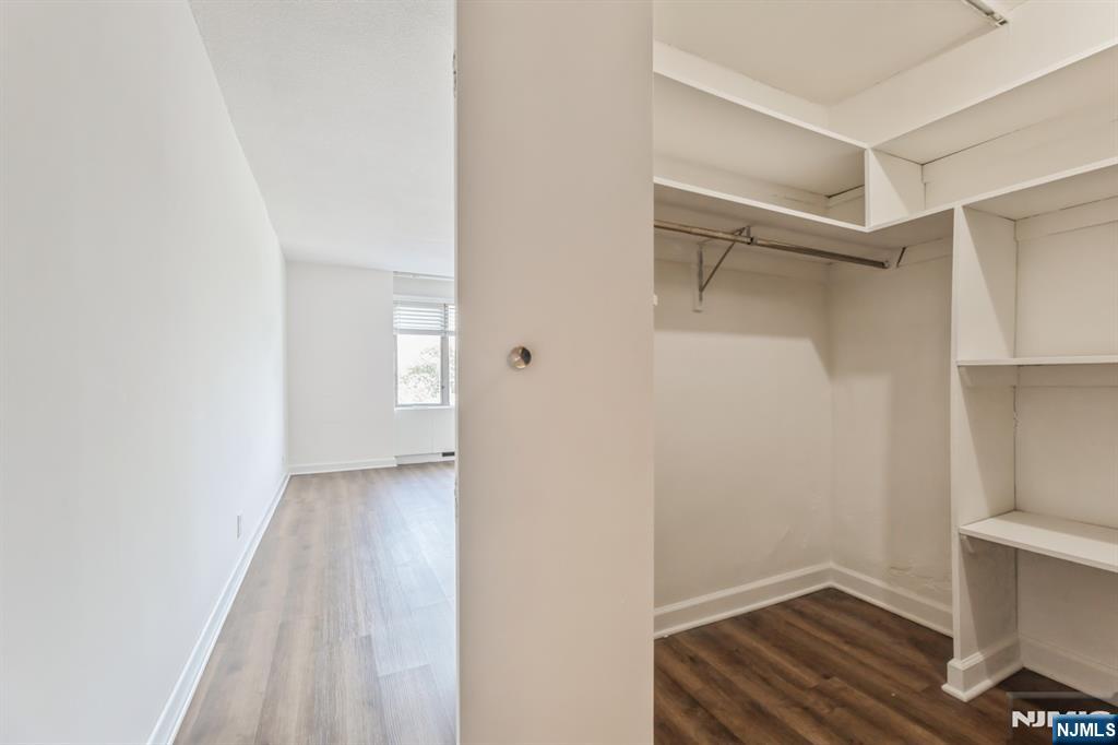 6 Horizon Road, Unit 310 Fort Lee, NJ 07024 - Photo 21 of 35 a view of an empty room with wooden floor and closet