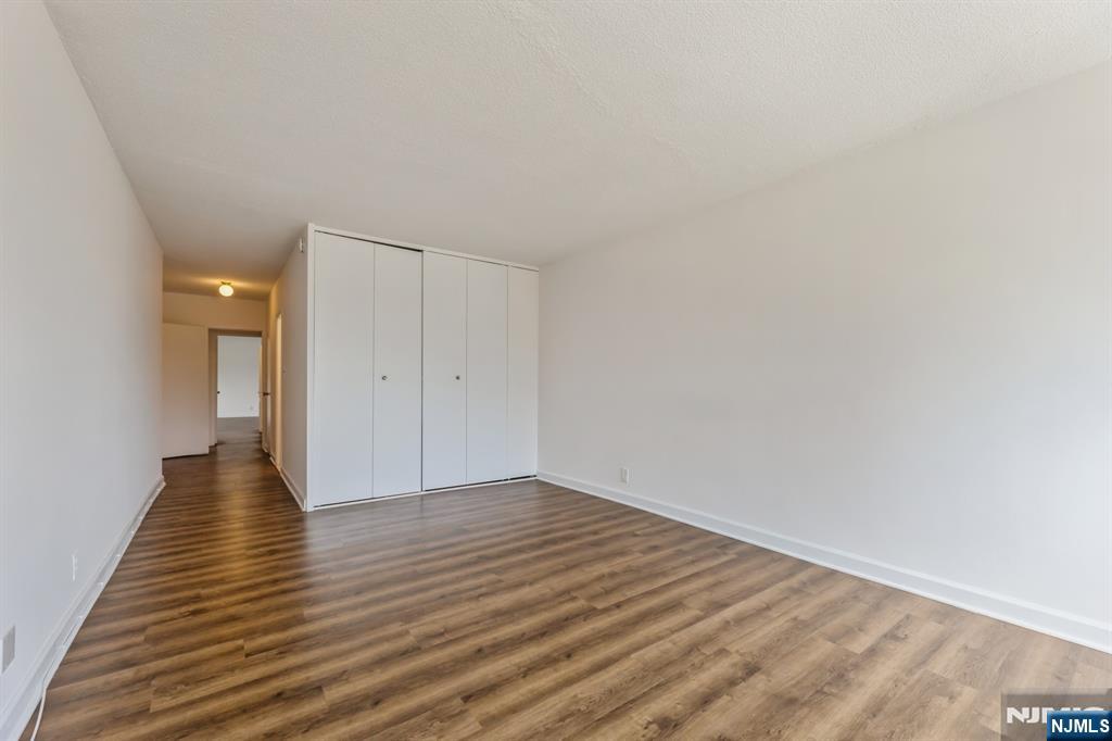 6 Horizon Road, Unit 310 Fort Lee, NJ 07024 - Photo 27 of 35 a view of an empty room with wooden floor