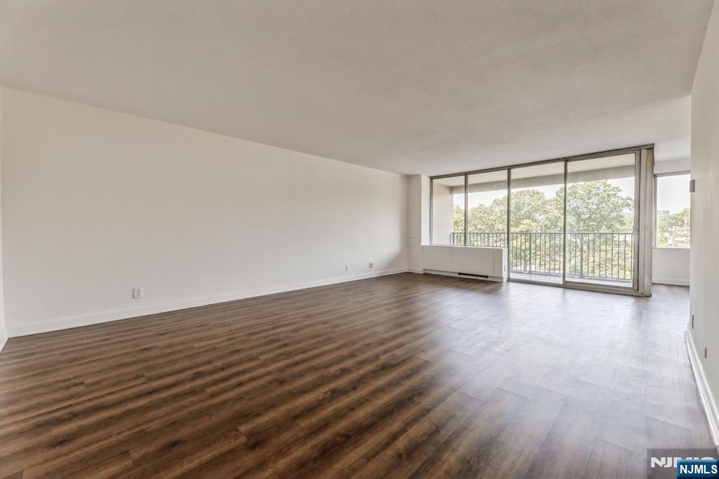 6 Horizon Road, Unit 310 Fort Lee, NJ 07024 - Photo 8 of 35 wooden floor in an empty room with a window