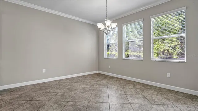 a view of staircase with lots of frames on wall and a rug