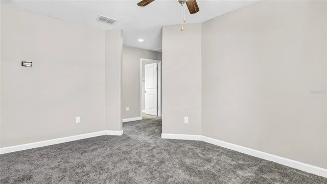 a spacious bathroom with a granite countertop sink a large mirror a shower and a bathtub