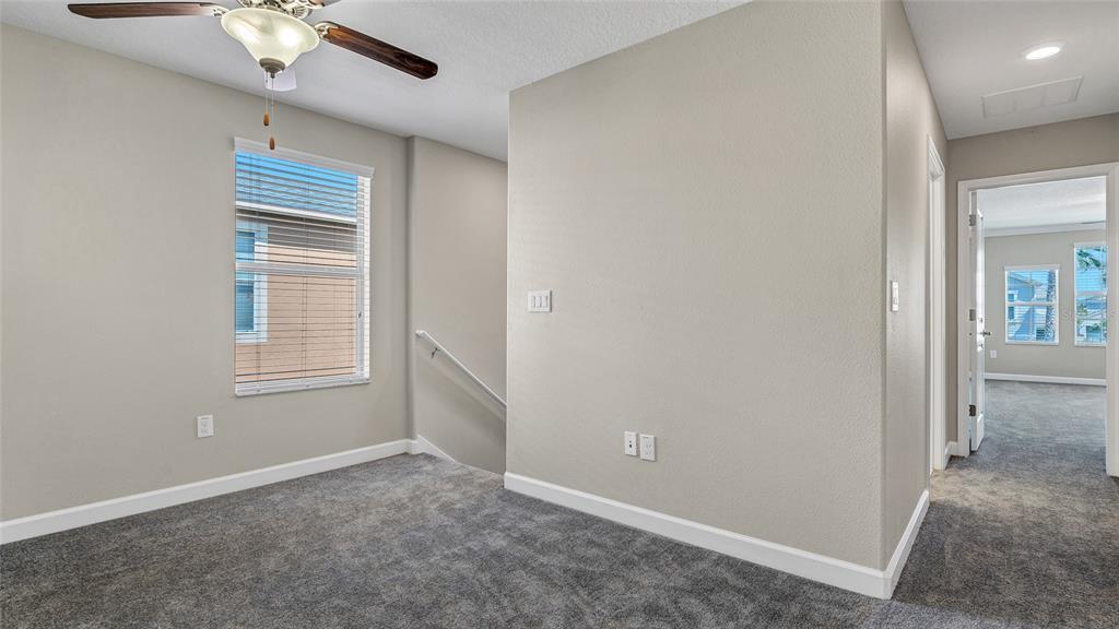1695 Ludington Avenue Wesley Chapel, FL 33543 - Photo 23 of 65 a view of an empty room with a window