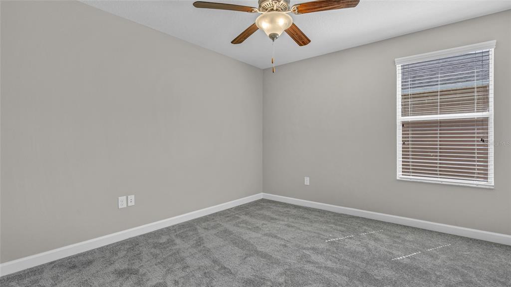 1695 Ludington Avenue Wesley Chapel, FL 33543 - Photo 38 of 65 an empty room with a window