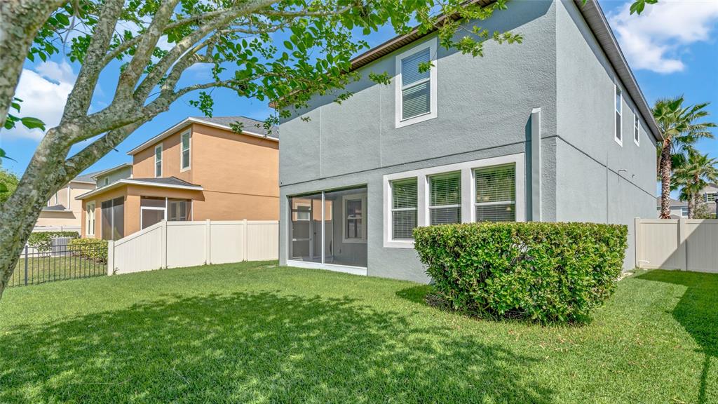 1695 Ludington Avenue Wesley Chapel, FL 33543 - Photo 47 of 65 a view of house with yard