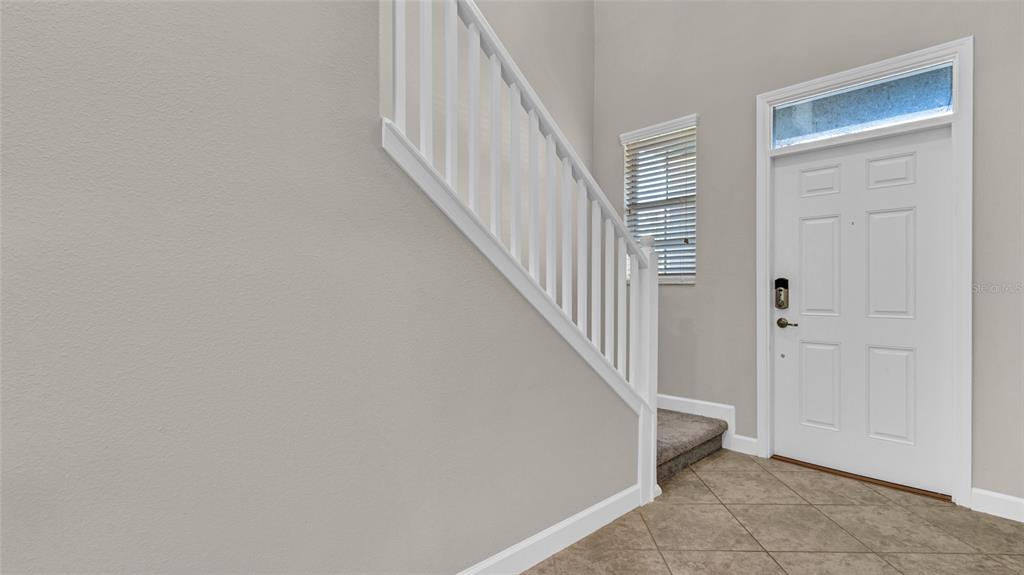 1695 Ludington Avenue Wesley Chapel, FL 33543 - Photo 5 of 65 a view of a hallway with a hallway