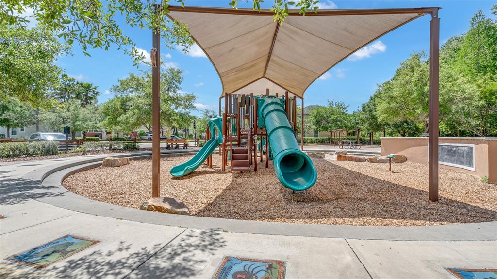 1695 Ludington Avenue Wesley Chapel, FL 33543 - Photo 53 of 65 a view of a park with swings and slides