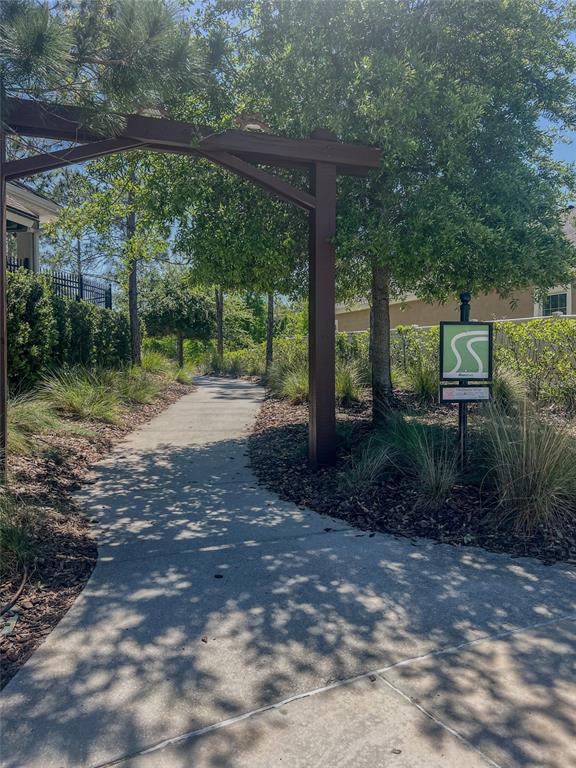 1695 Ludington Avenue Wesley Chapel, FL 33543 - Photo 58 of 65 a view of a yard with porch