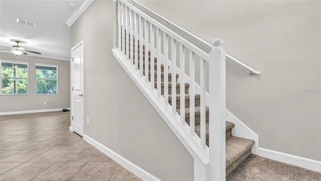 a view of a kitchen with granite countertop a sink and a stove