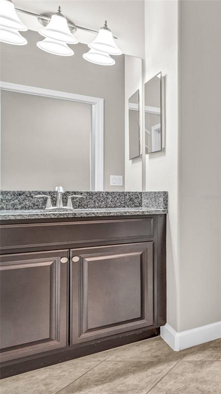 1695 Ludington Avenue Wesley Chapel, FL 33543 - Photo 7 of 65 a close view of granite countertop a fireplace