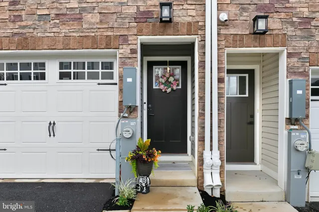 a front view of a house with a glass door