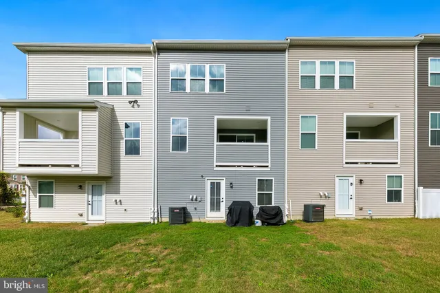 a front view of a house with yard