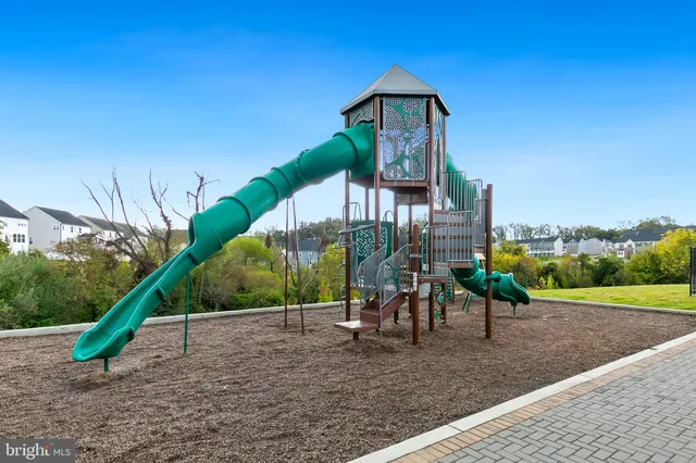 a view of a patio with table and chairs and potted plants