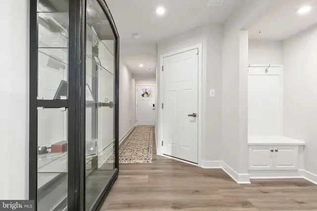 a living room with furniture and a lamp