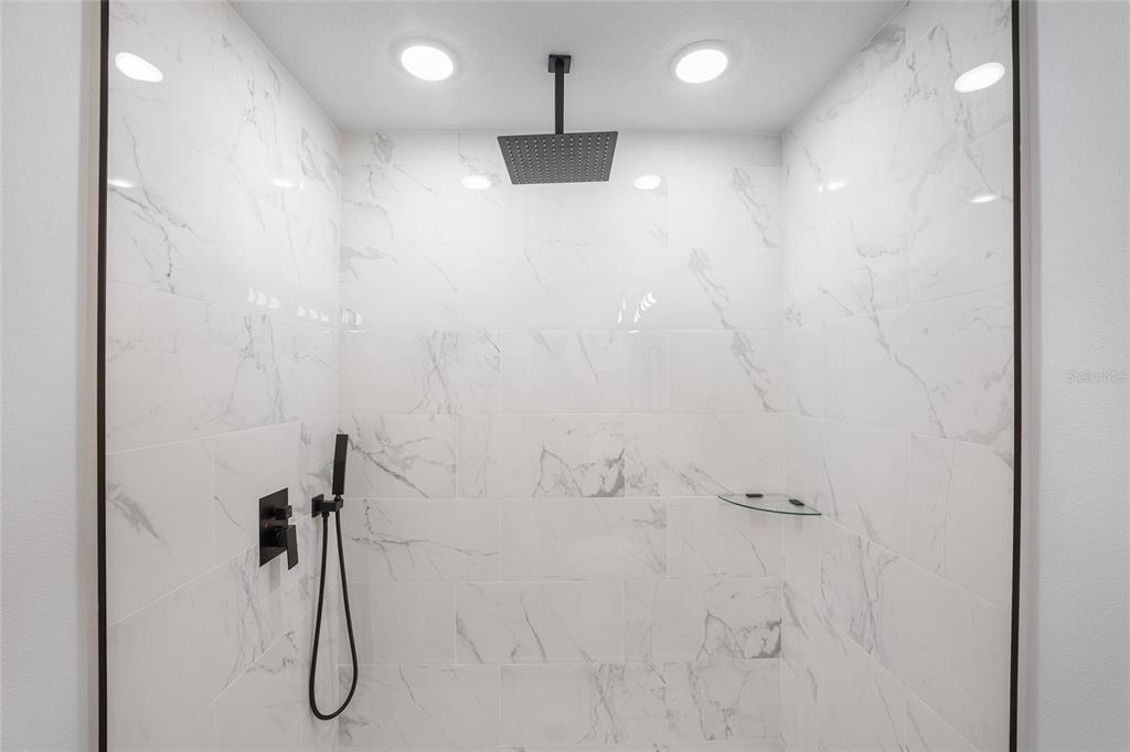 3244 Southeast 147th Lane Summerfield, FL 34491 - Photo 15 of 25 a bathroom with a shower
