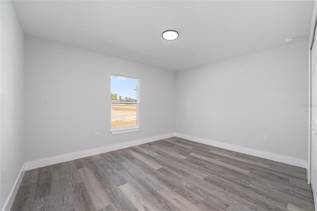 3244 Southeast 147th Lane Summerfield, FL 34491 - Photo 17 of 25 a view of an empty room and window