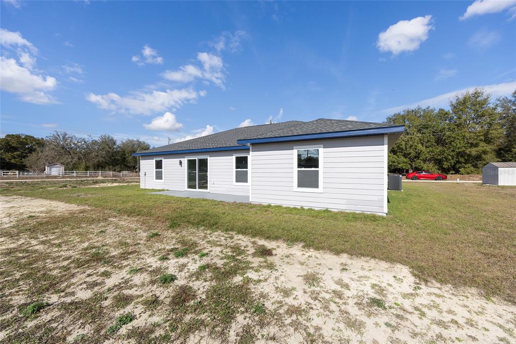 3244 Southeast 147th Lane Summerfield, FL 34491 - Photo 25 of 25 a front view of a house with a yard