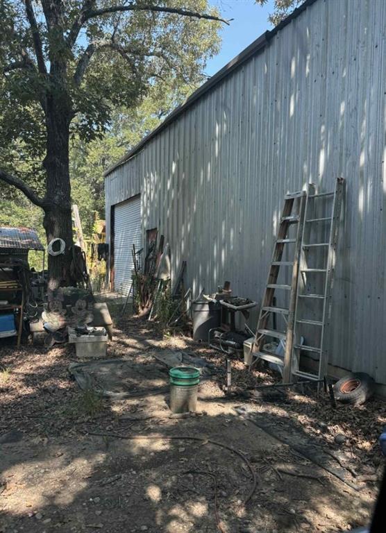 928 County Road 1660 Alba, TX 75410 - Photo 7 of 17 a backyard of a house with barbeque oven and outdoor seating