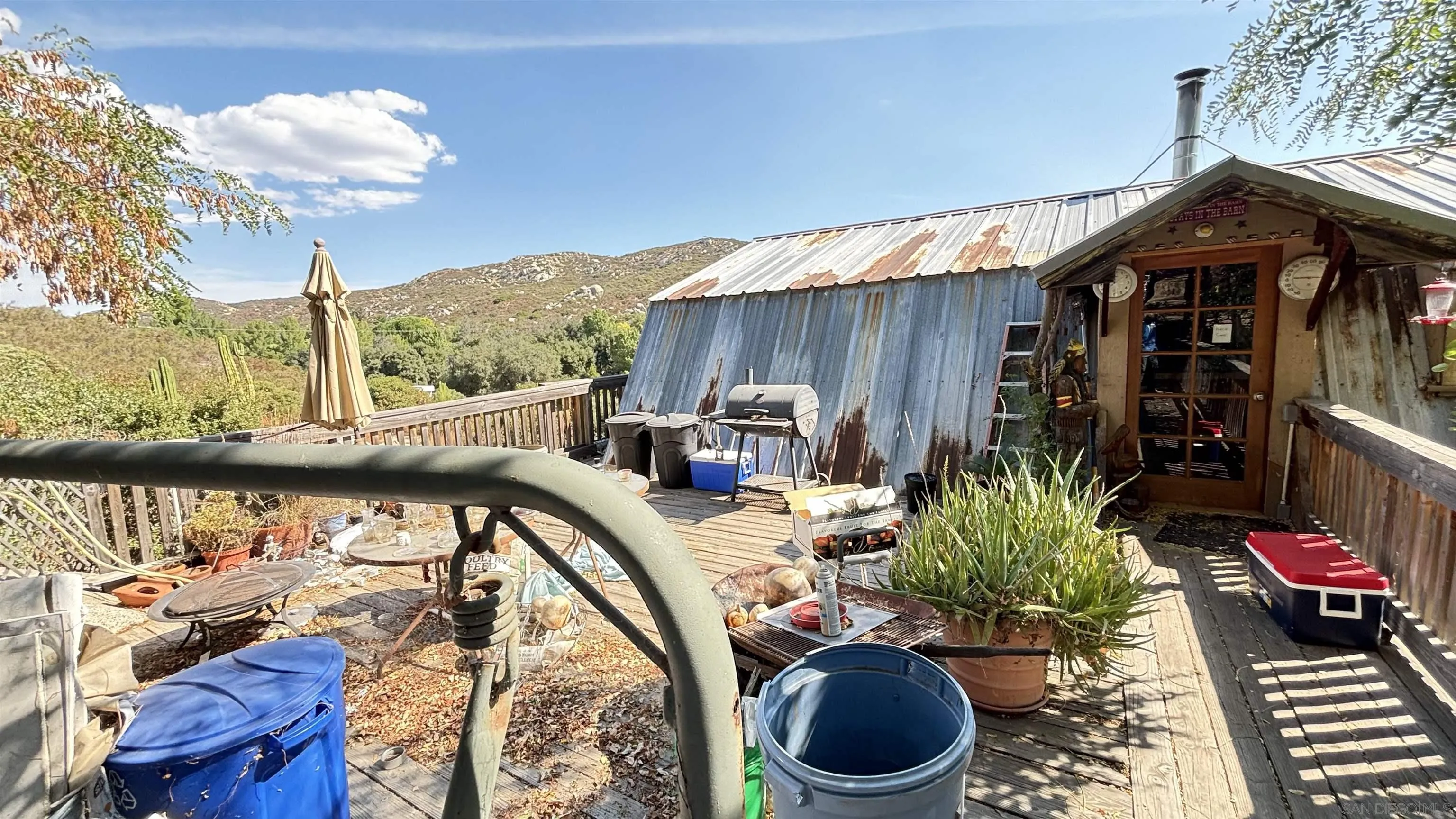 2602 La Posta Road Campo, CA 91906 - Photo 5 of 16 a backyard of a house with lots of furniture and outdoor seating