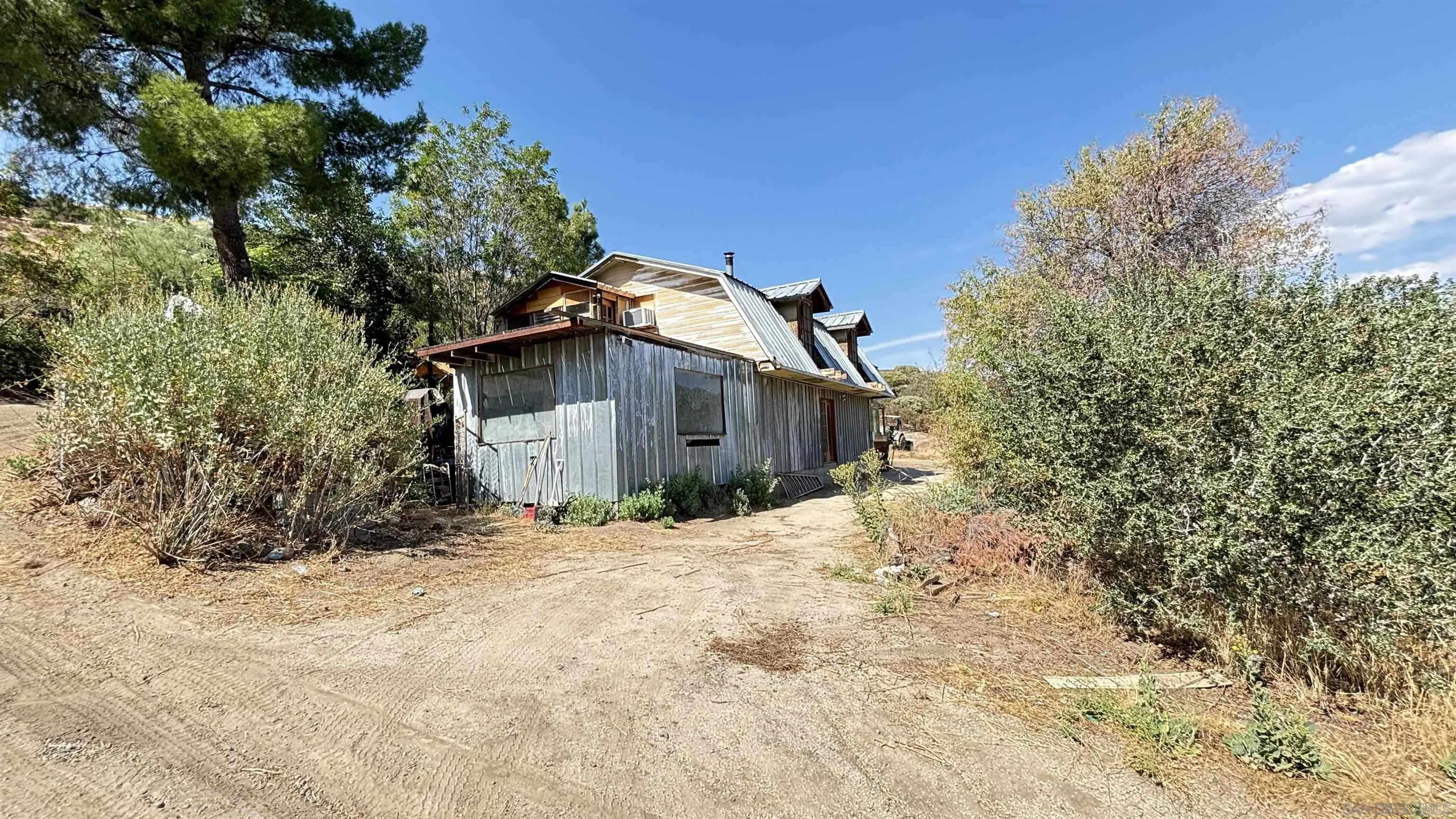 2602 La Posta Road Campo, CA 91906 - Photo 7 of 16 a view of a wooden house with a yard