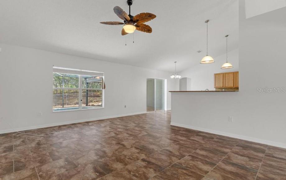 12411 Convent Garden Road Brooksville, FL 34613 - Photo 13 of 49 a view of an empty room with a window