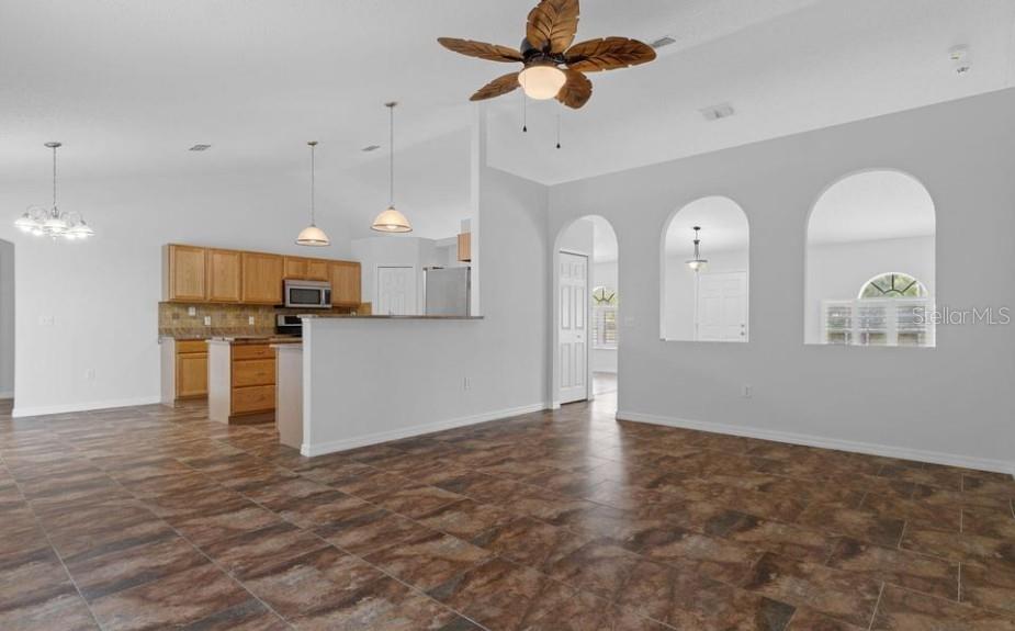 12411 Convent Garden Road Brooksville, FL 34613 - Photo 17 of 49 a view of kitchen with cabinets and wooden floor