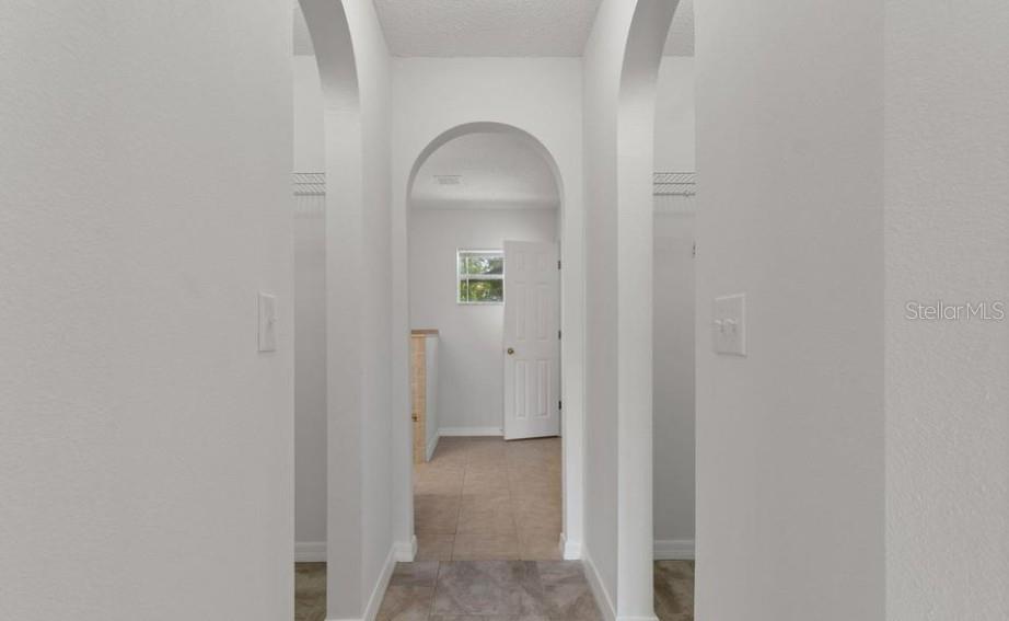 12411 Convent Garden Road Brooksville, FL 34613 - Photo 30 of 49 a view of wooden floor in a room