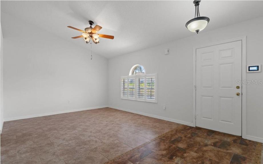 12411 Convent Garden Road Brooksville, FL 34613 - Photo 3 of 49 a view of an empty room with a window