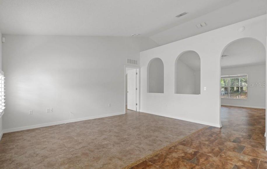 12411 Convent Garden Road Brooksville, FL 34613 - Photo 6 of 49 a view of an empty room