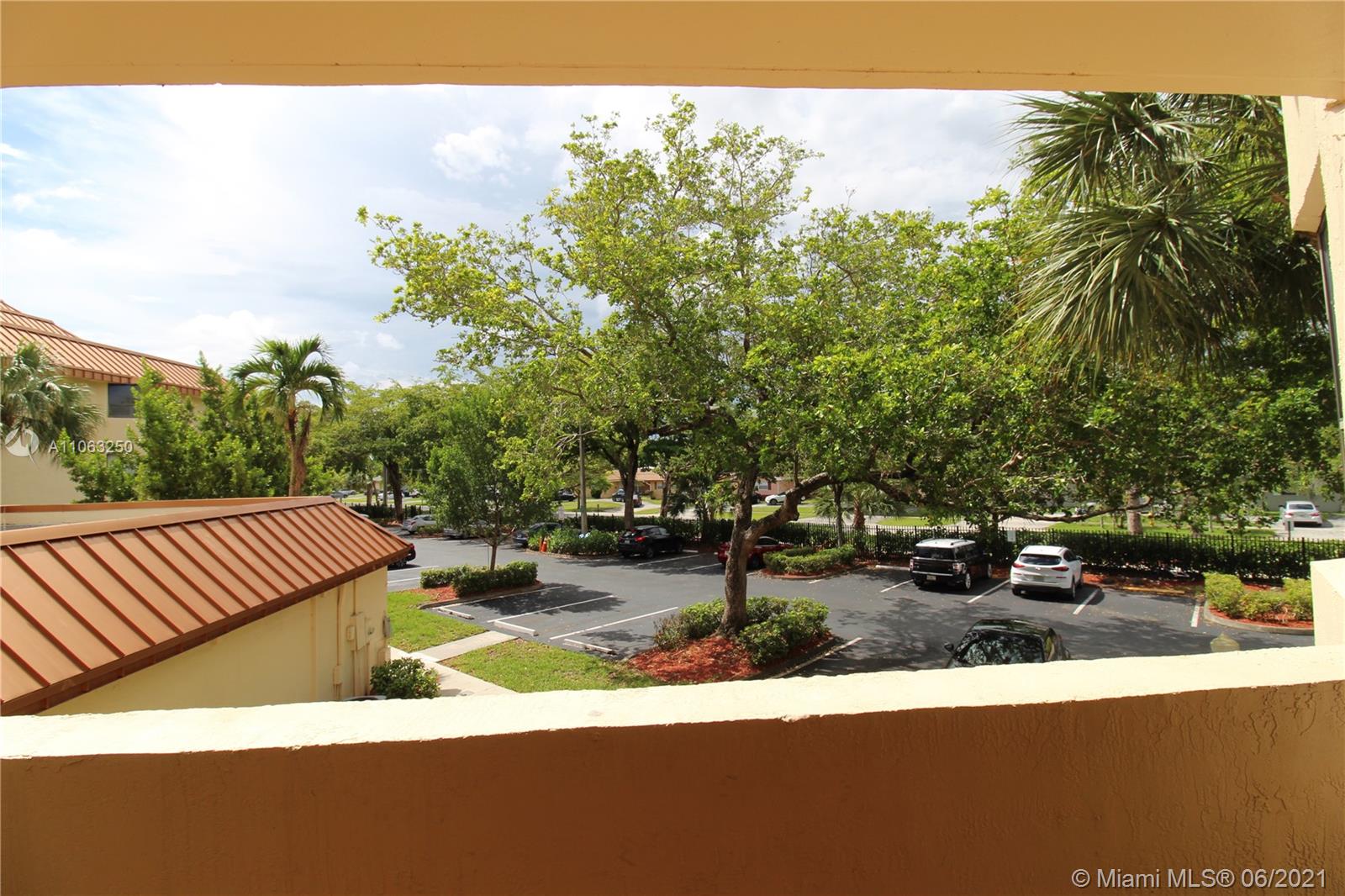 7451 Northwest 16th Street, Unit 210 Plantation, FL 33313 - Photo 11 of 16 a view of a backyard with sitting area