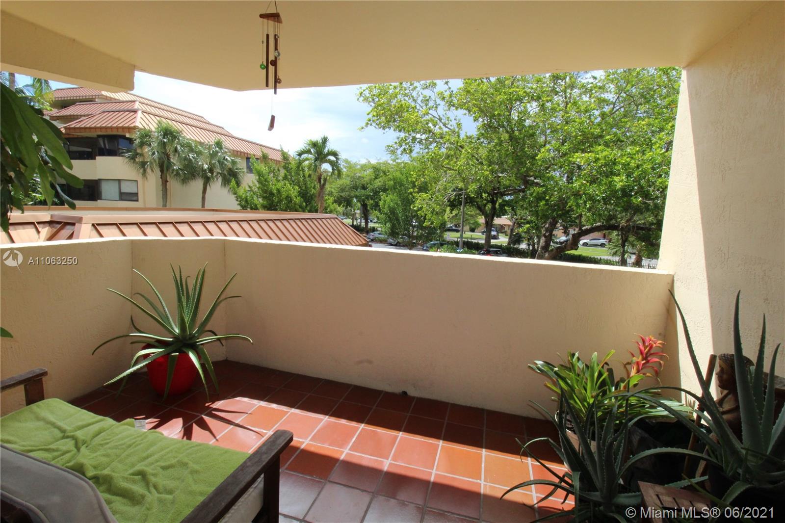 7451 Northwest 16th Street, Unit 210 Plantation, FL 33313 - Photo 12 of 16 a view of balcony with a potted plant