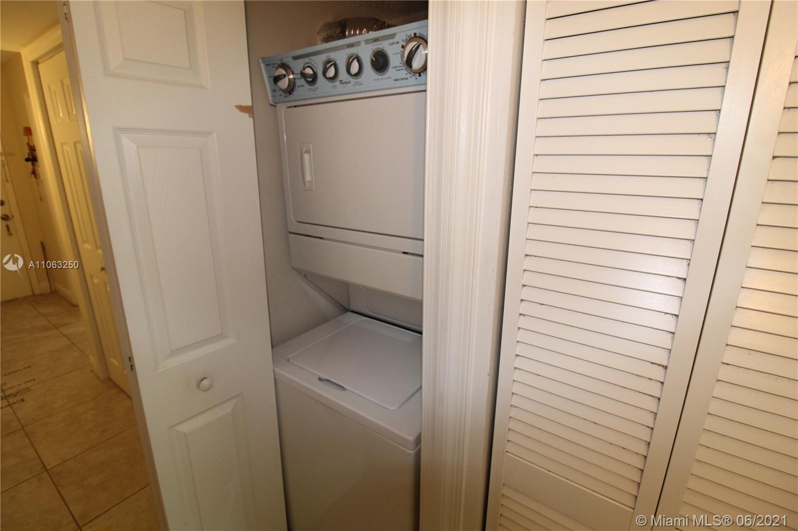 7451 Northwest 16th Street, Unit 210 Plantation, FL 33313 - Photo 13 of 16 a utility room with dryer and washer