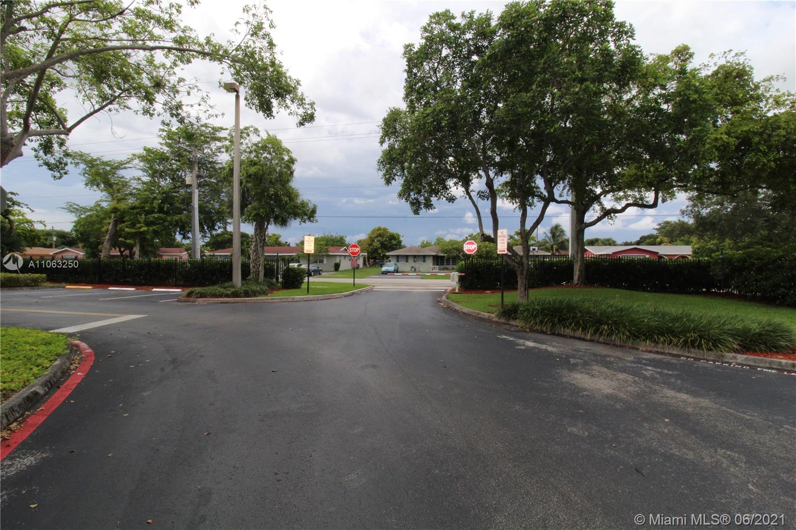 7451 Northwest 16th Street, Unit 210 Plantation, FL 33313 - Photo 16 of 16 a view of a street with a house in the background