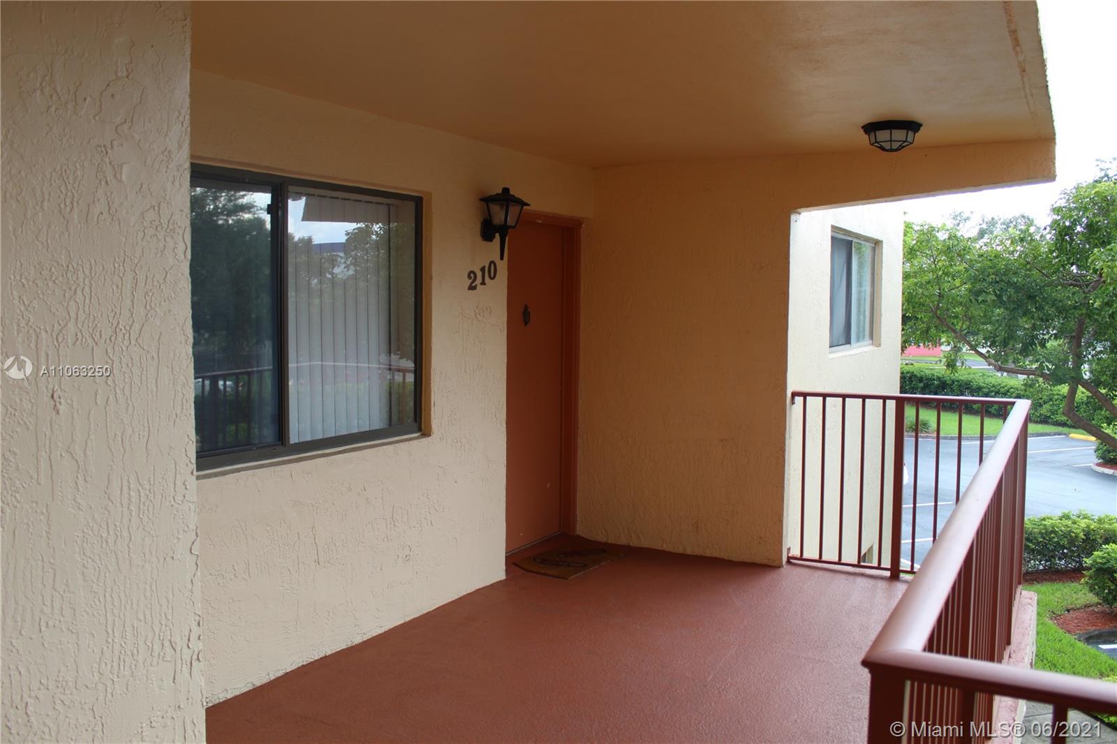 7451 Northwest 16th Street, Unit 210 Plantation, FL 33313 - Photo 3 of 16 an empty room with windows