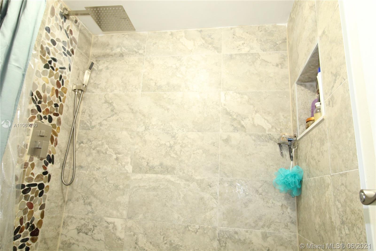 7451 Northwest 16th Street, Unit 210 Plantation, FL 33313 - Photo 8 of 16 a bathroom with a shower