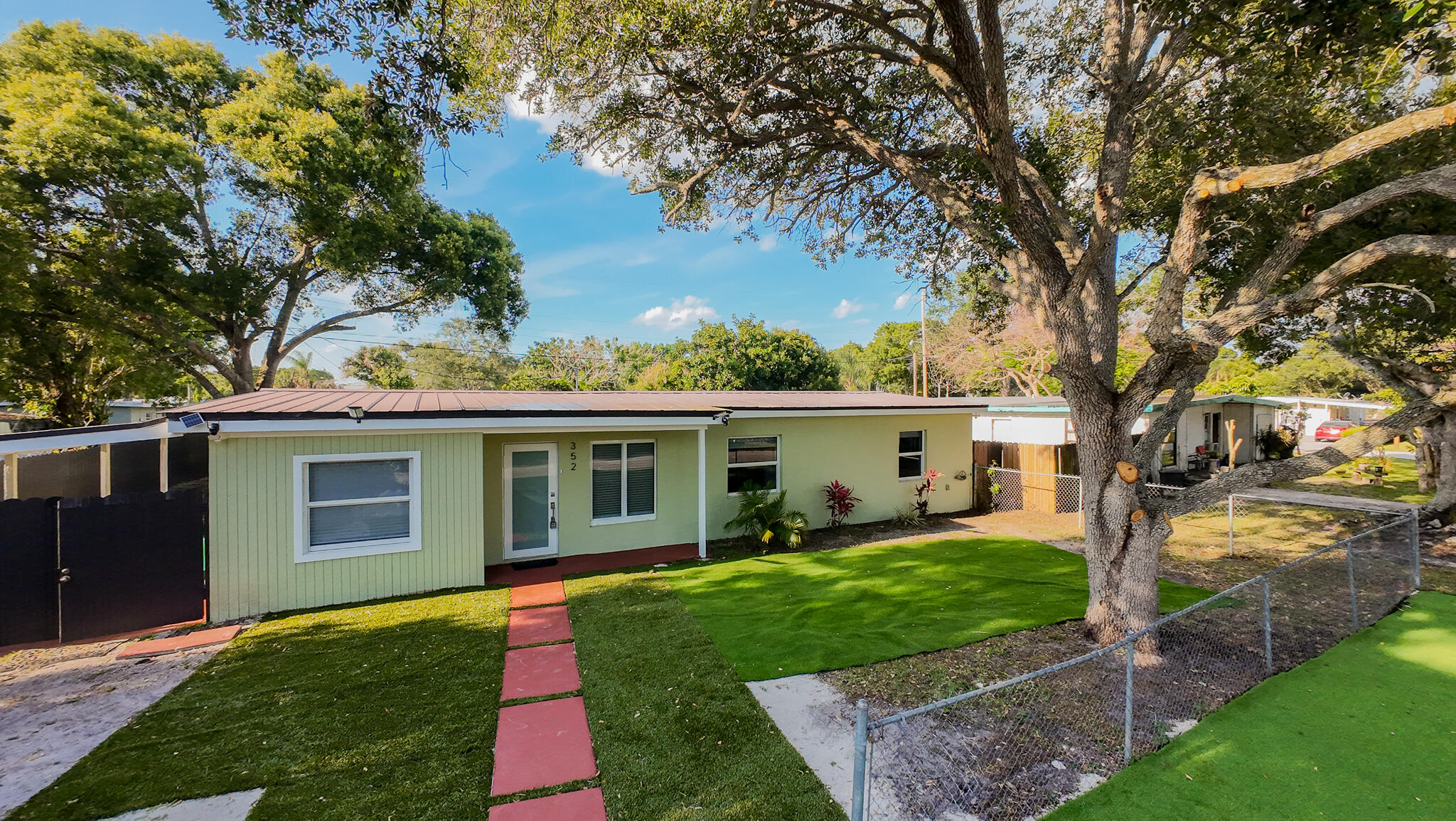 352 Johnston Street Fort Pierce, FL 34982 - Photo 1 of 28 front view of a house with a yard