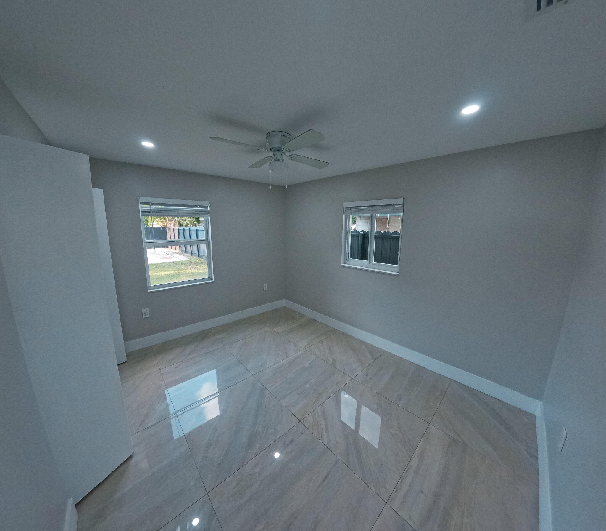 352 Johnston Street Fort Pierce, FL 34982 - Photo 17 of 28 a view of an empty room and a window