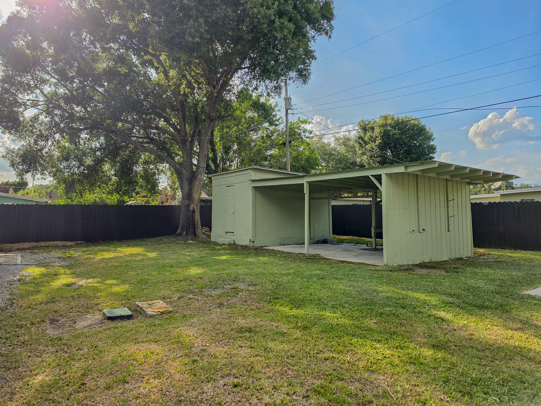 352 Johnston Street Fort Pierce, FL 34982 - Photo 23 of 28 a view of a backyard with a garden and plants
