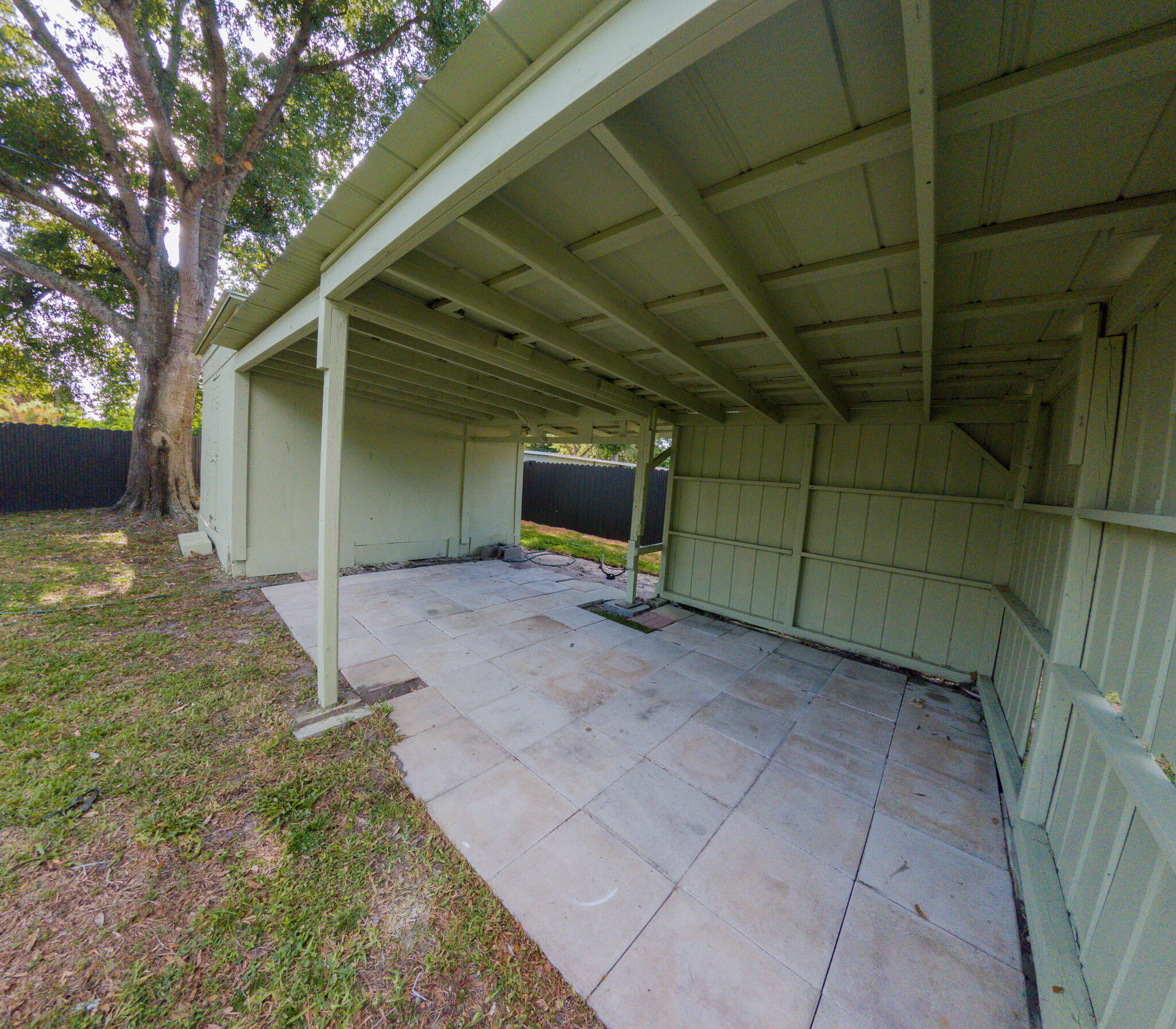 352 Johnston Street Fort Pierce, FL 34982 - Photo 25 of 28 a view of a house with backyard and trees