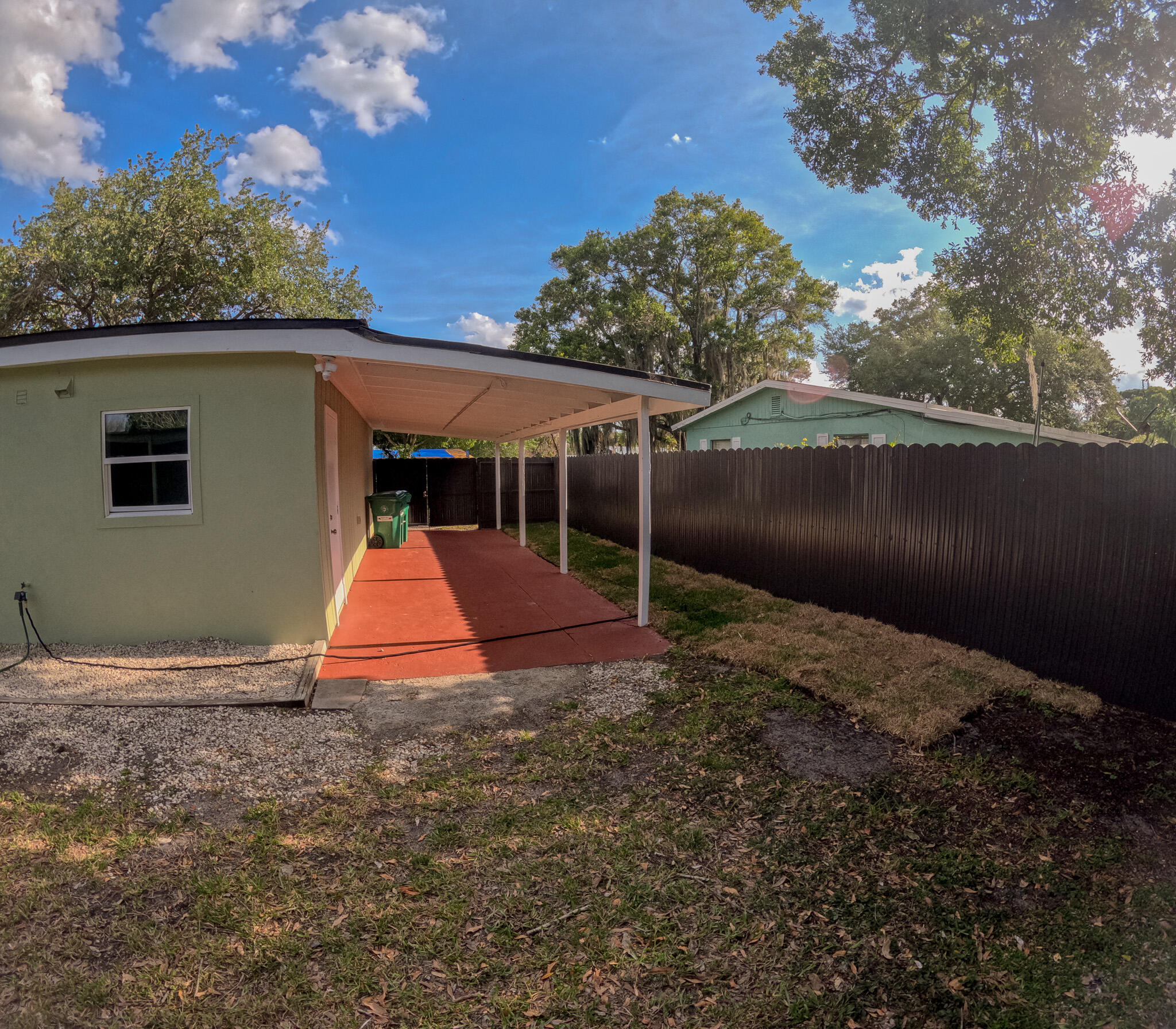 352 Johnston Street Fort Pierce, FL 34982 - Photo 3 of 28 a view of backyard with green space