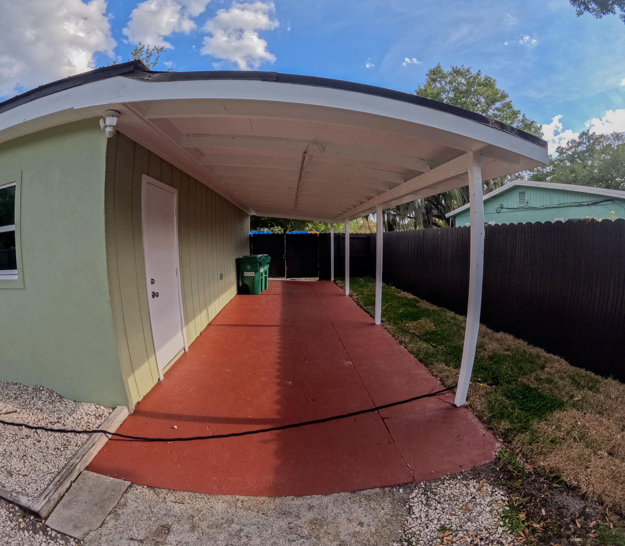352 Johnston Street Fort Pierce, FL 34982 - Photo 4 of 28 a backyard of a house with yard and outdoor seating