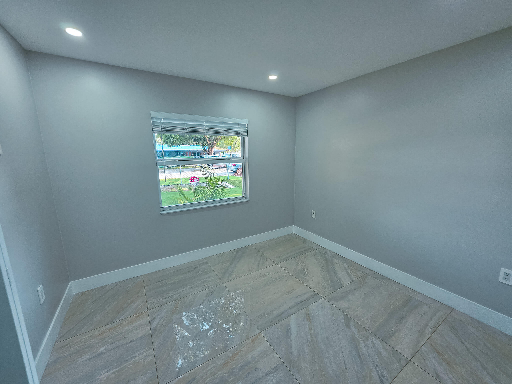 352 Johnston Street Fort Pierce, FL 34982 - Photo 8 of 28 an empty room with windows