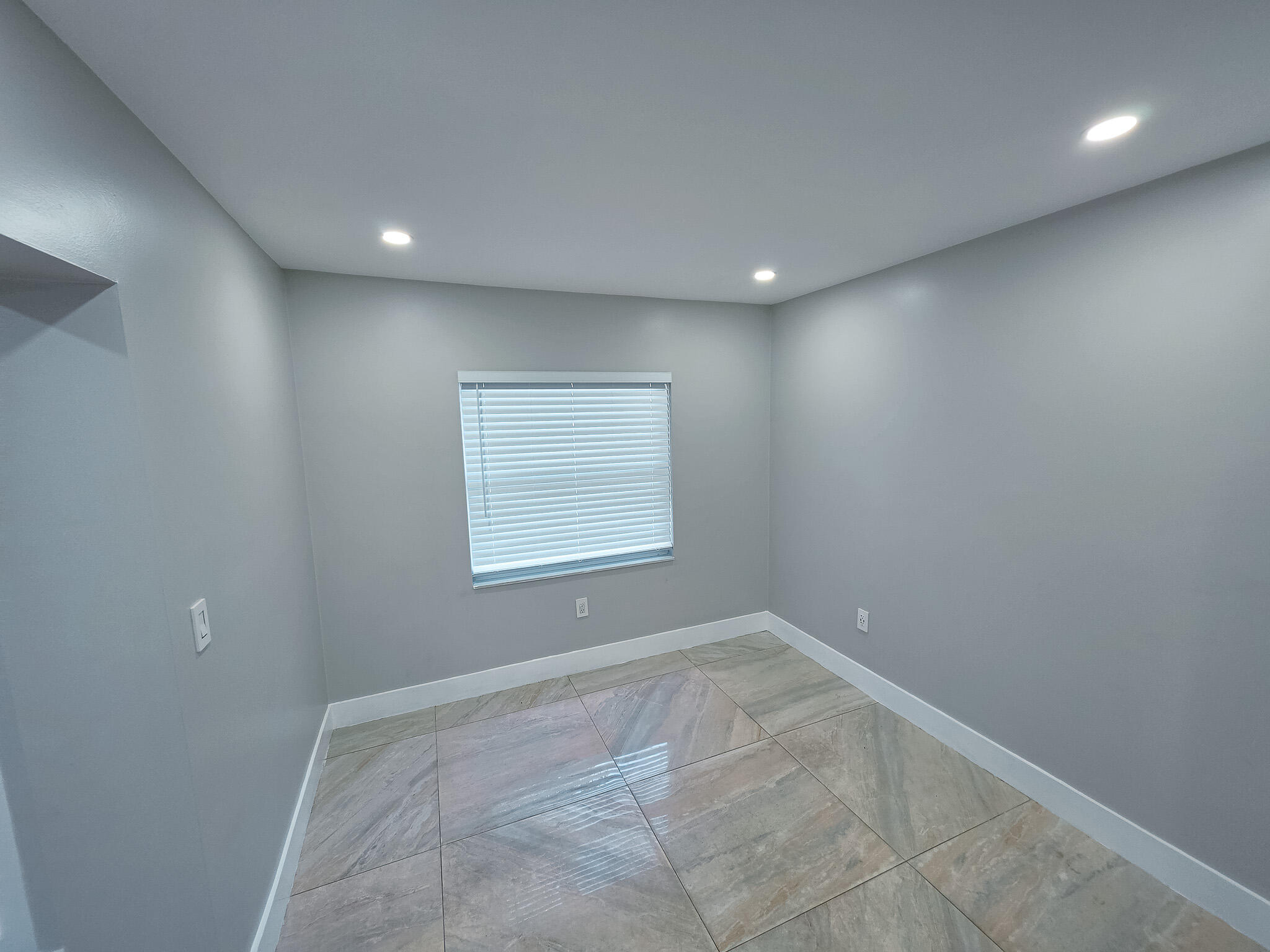 352 Johnston Street Fort Pierce, FL 34982 - Photo 9 of 28 a view of an empty room with a window
