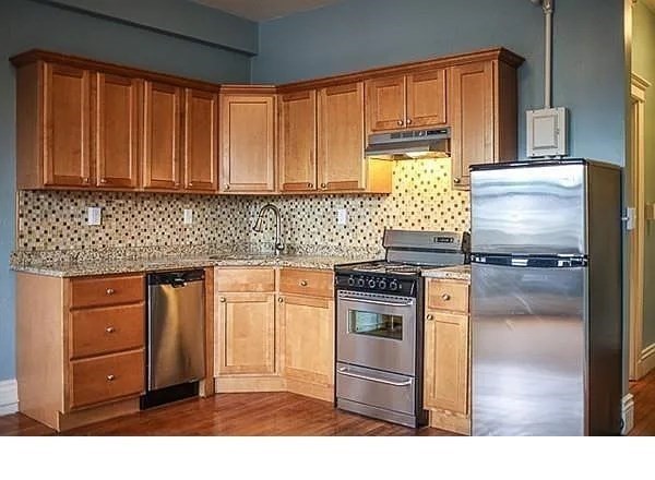 270 Huntington Avenue, Unit 304 Boston, MA 02115 - Photo 2 of 10 a kitchen with granite countertop a refrigerator stove and sink