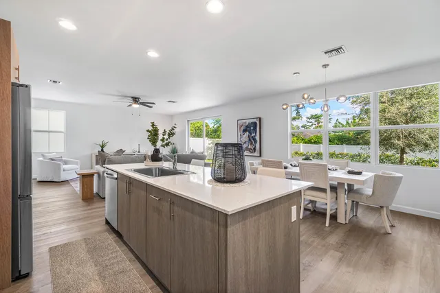 a kitchen with a table and chairs in it