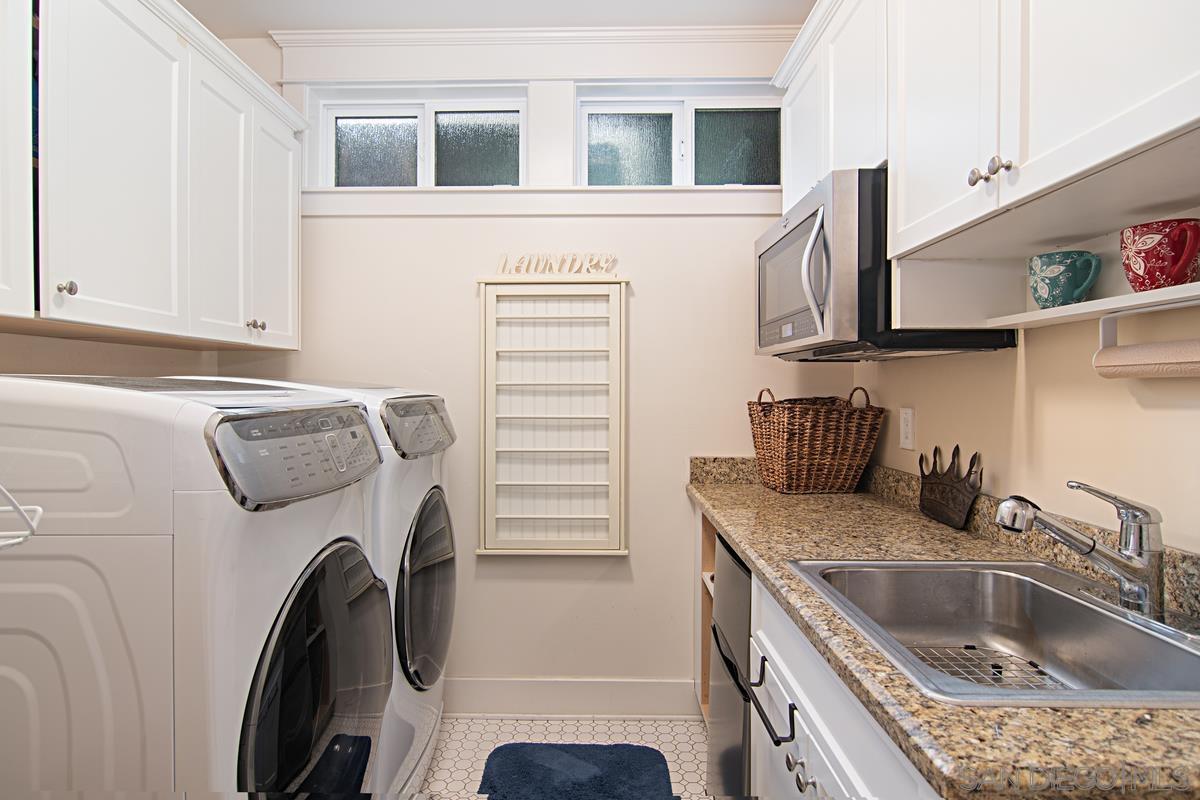 918 D Coronado Ca Coronado, CA 92118 - Photo 15 of 27 a kitchen that has a sink and a stove