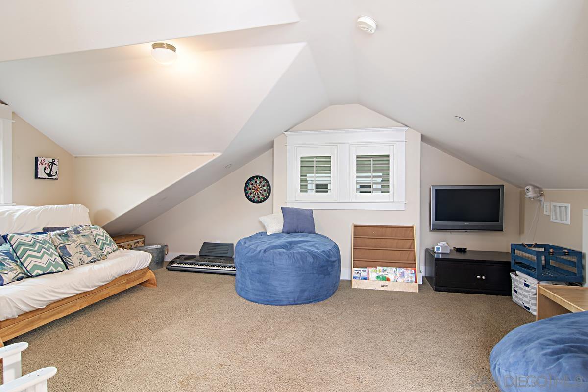918 D Coronado Ca Coronado, CA 92118 - Photo 25 of 27 a living room with furniture and a flat screen tv